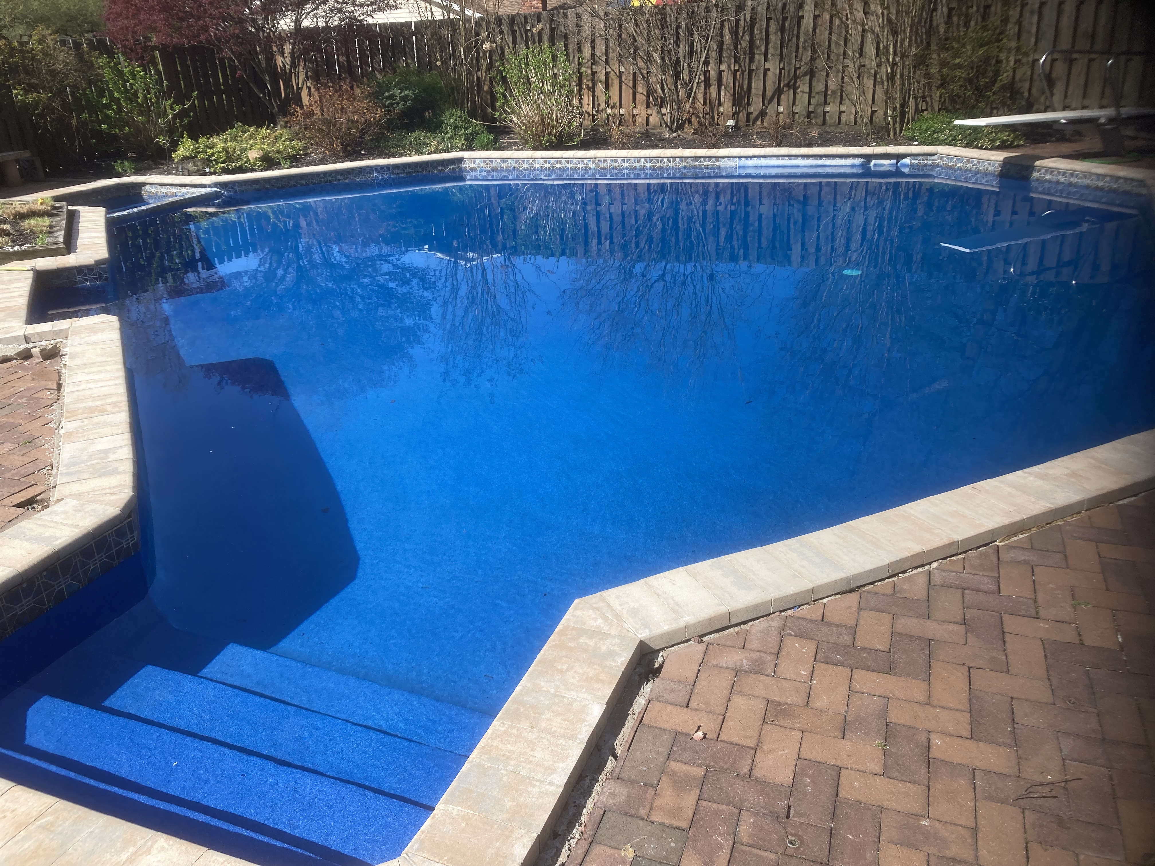 Beautifully renovated pool in Montville NJ featuring ecoFinish resurfacing, Nicolock bullnose coping, and refreshed tile line