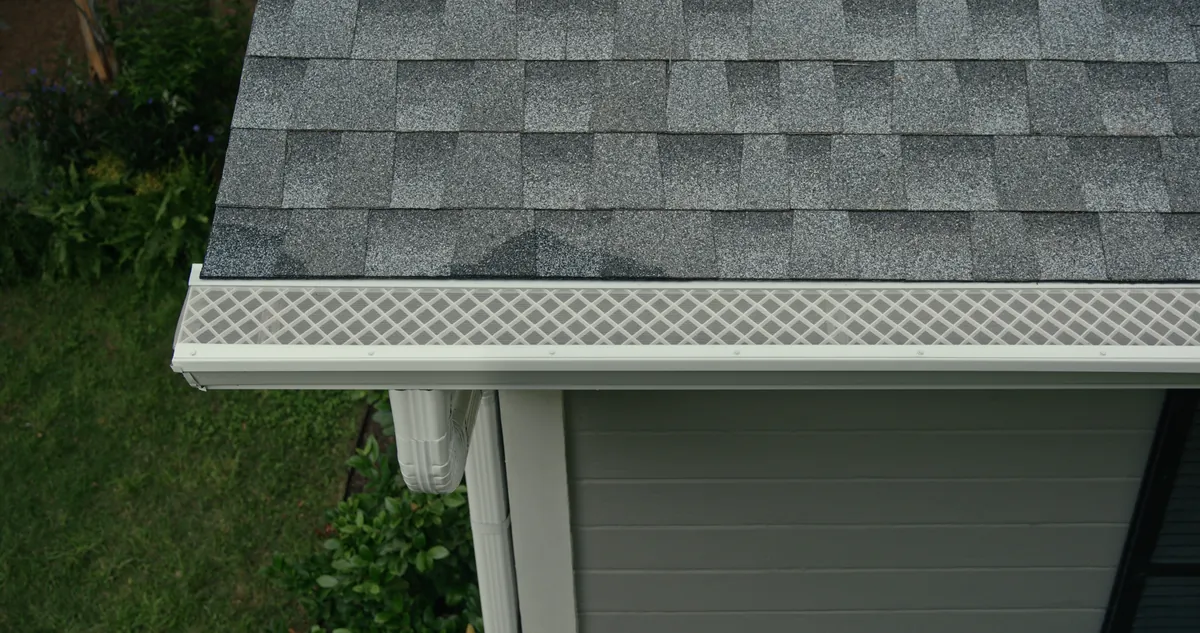 Home roofline with LeafFilter gutter protection installed for year-round defense