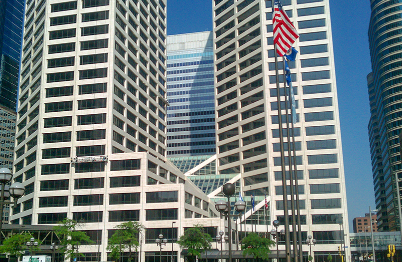 U.S. Bank Plaza building stone restoration in Minneapolis showing detailed facade work on 60-story high-rise