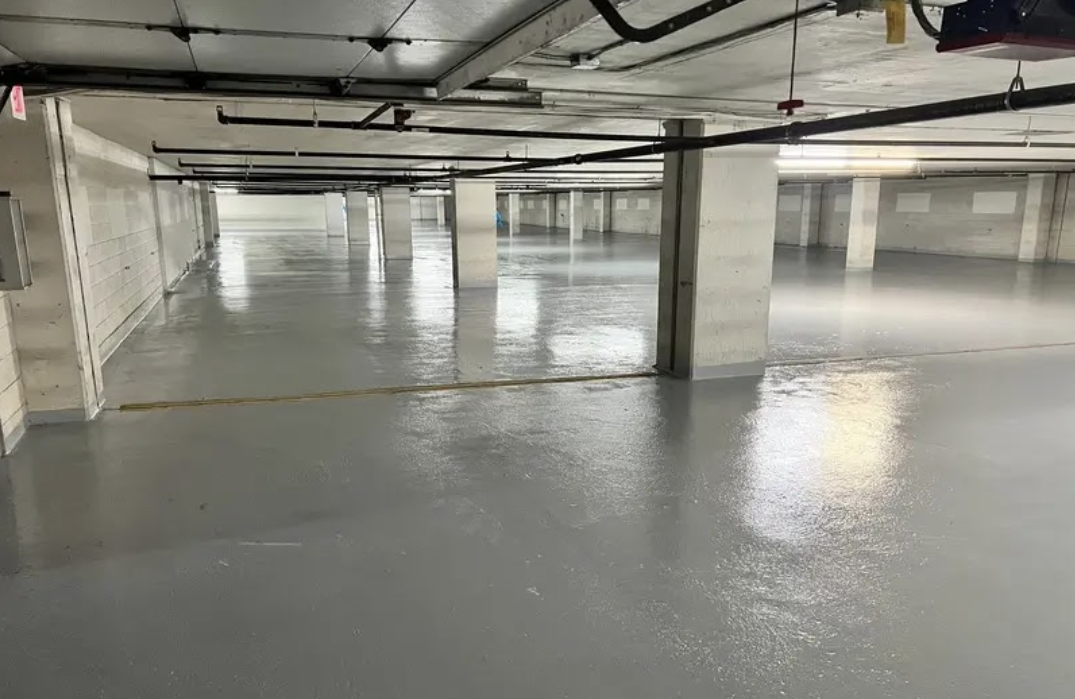 Comprehensive parking structure restoration at RiverWest Garage in Minneapolis showing expert concrete repair work