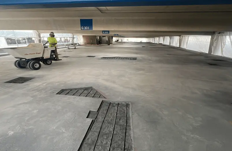 Pine Street Ramps municipal parking structure in Green Bay, Wisconsin during multi-system concrete restoration including expansion joint replacement and traffic bearing membrane installation