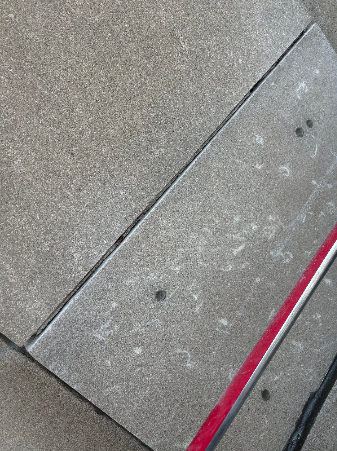 Deteriorated mortar joints on the Wisconsin Tower Condominiums showing failed tuckpointing before restoration