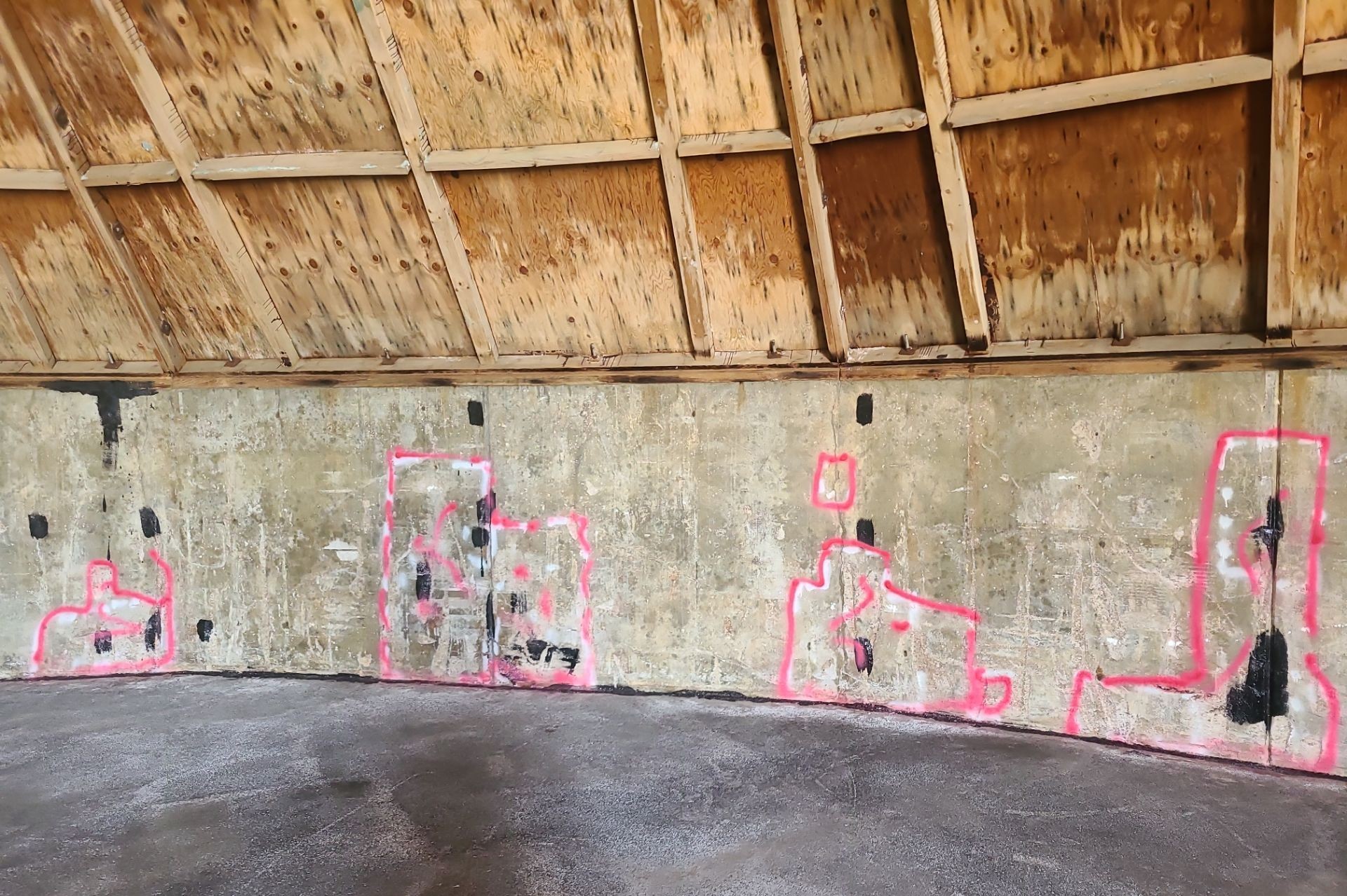 Salt shed foundation wall after concrete repair patches, prior to epoxy coating application