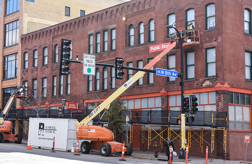 Historic facade restoration at 425 Washington Avenue in Minneapolis, showing completed tuckpointing and brick replacement in the warehouse district
