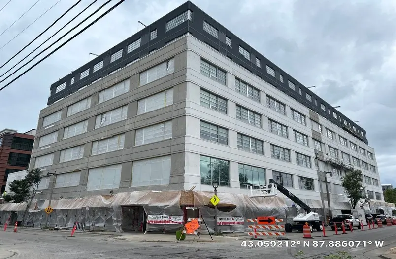 Kenilworth Square Apartments envelope restoration in Milwaukee, Wisconsin — failed coating removal and sealant replacement on residential building façade