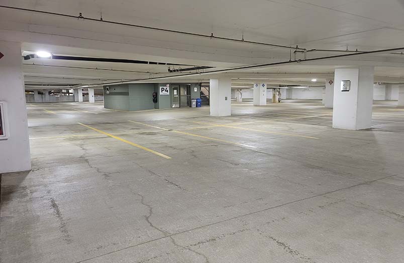 St. Paul commercial parking structure during comprehensive rehabilitation including traffic coating installation and structural concrete repairs