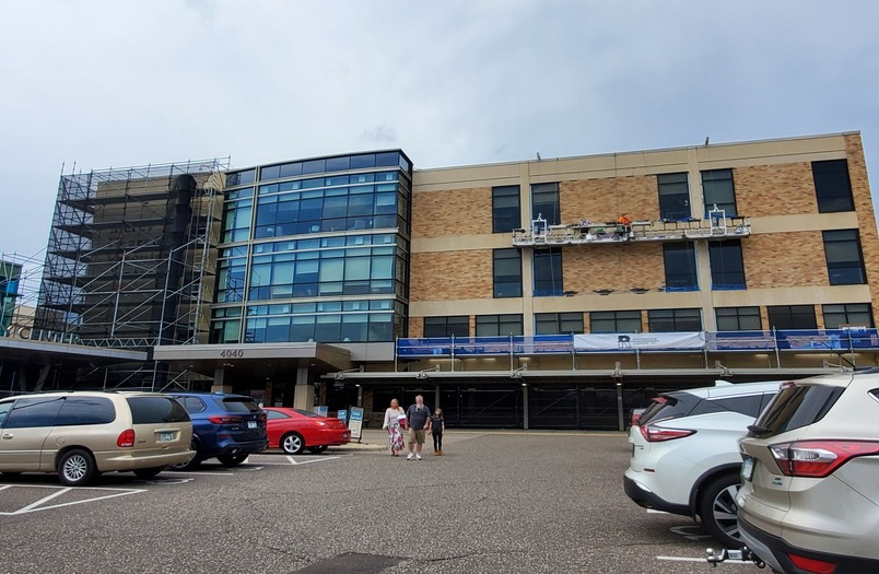 Sealant replacement coordinated with masonry flashing and brick repair at Mercy Heart Hospital in Coon Rapids, Minnesota