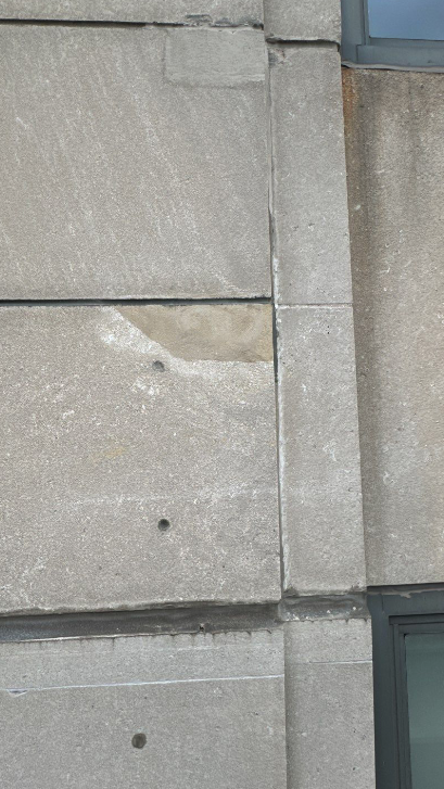 Restored stone on the Wisconsin Tower Condominiums after RSI's expert stone patching work