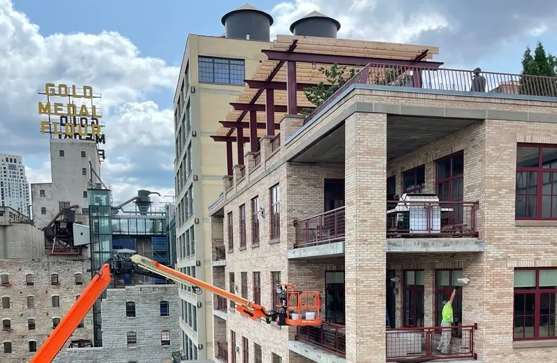 Stone Arch Lofts tuckpointing project showing historic masonry restoration work in Minneapolis