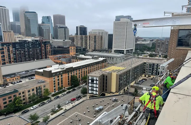 RiverWest building facade in Minneapolis showing completed restoration with polyurethane waterproofing at balcony locations