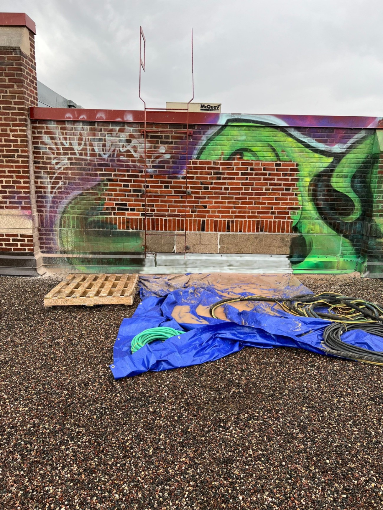 Graffiti removal process in progress on the Bio-Techne headquarters exterior