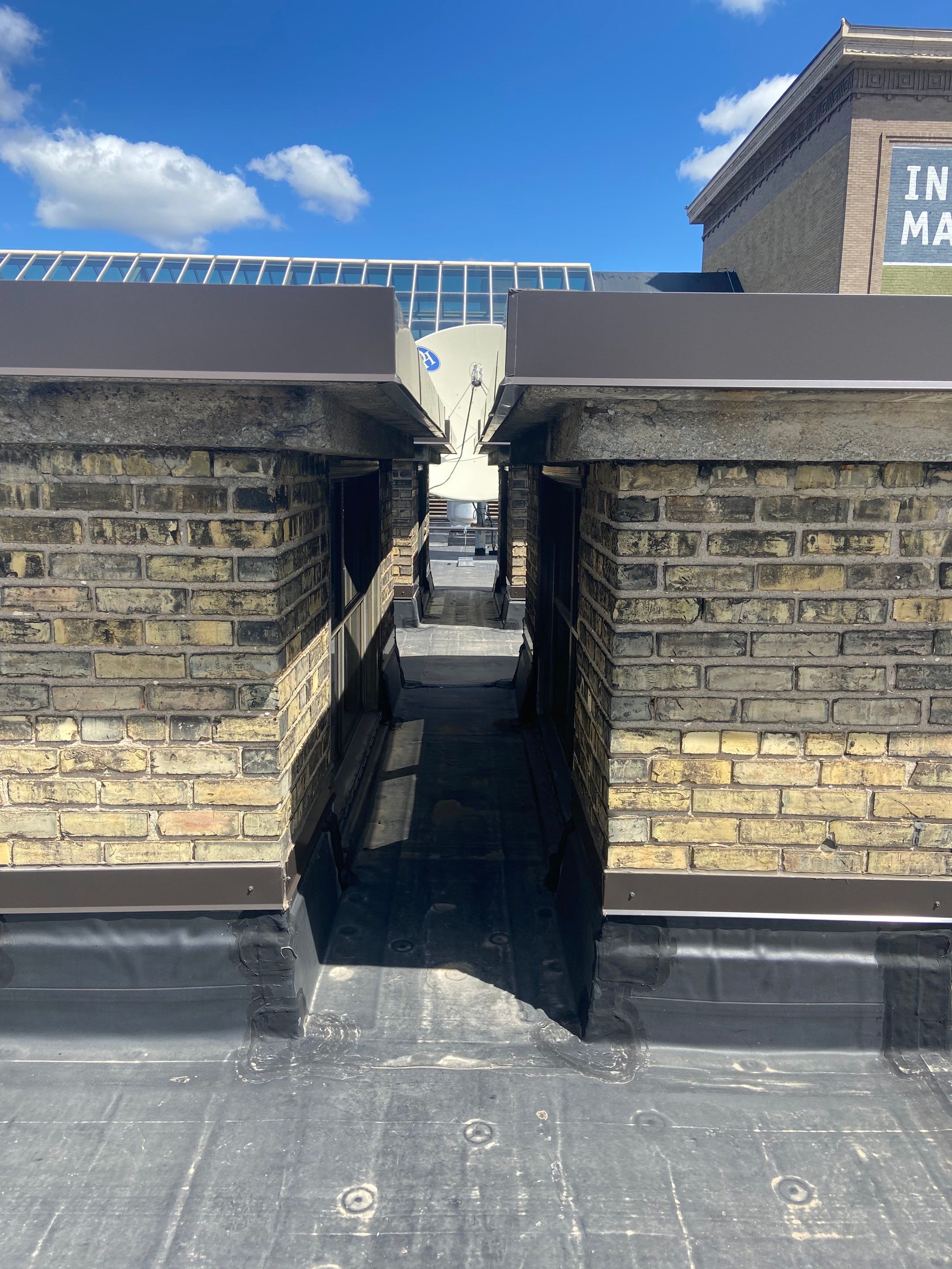 Close-up of historic brick masonry at International Market Square showing mortar joint details requiring precise material matching