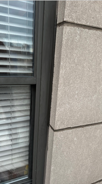 Sealant replacement work on the Wisconsin Tower Condominiums showing proper joint sealing techniques