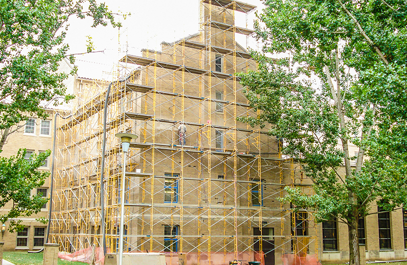 Lourdes Hall masonry repair project showing expert freeze-thaw damage restoration in Minnesota