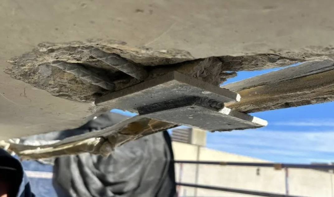 RSI team assessing parking deck deterioration in Appleton, Wisconsin, examining concrete damage patterns