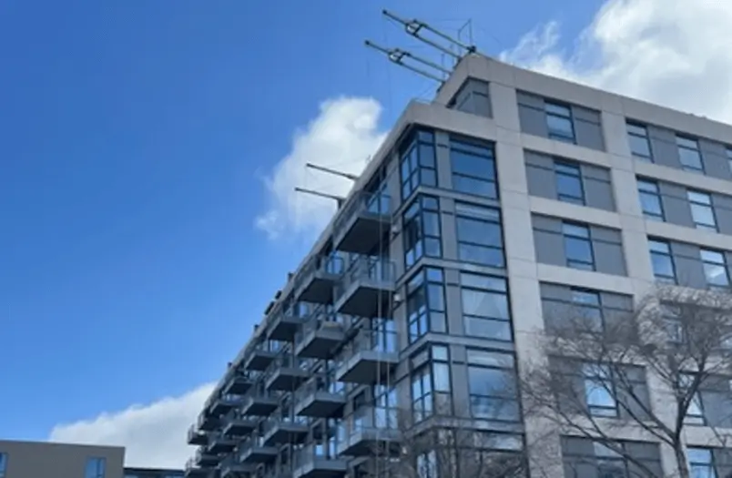 RSI sealant replacement work on 720 Lofts residential high-rise in Minneapolis, showing specialty rigging and façade access for window perimeter and control joint sealant work