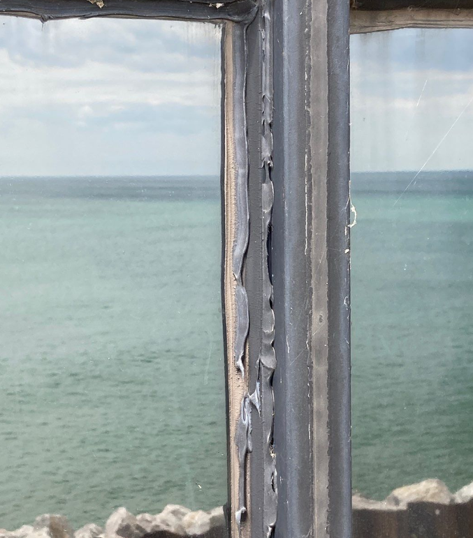 Close-up of professional sealant installation technique at University Campus project on Lake Michigan