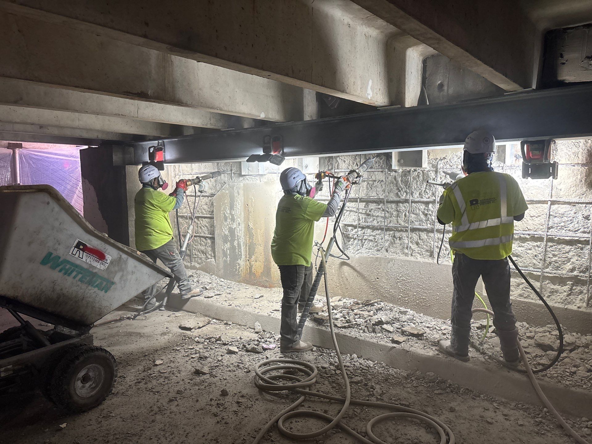 Bloomington parking ramp showing deteriorated concrete frame and broken precast tee stems prior to RSI structural shoring and repairs