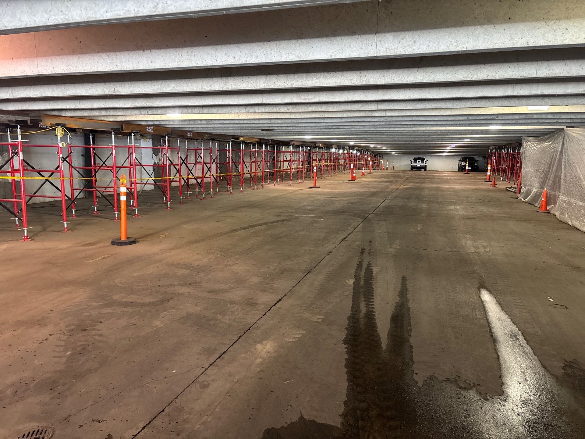 RSI crew performing structural shoring work beneath a concrete structure